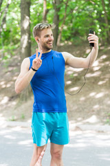 healthy life. athletic man in sportswear make selfie. outdoor workout. Fitness app. Ui ux concept. gadget in modern sport. muscular man in tracker. sport app on phone. digital sport. smart watch