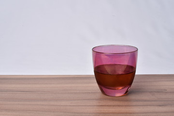 Colorful drinks glass cup on table on white background