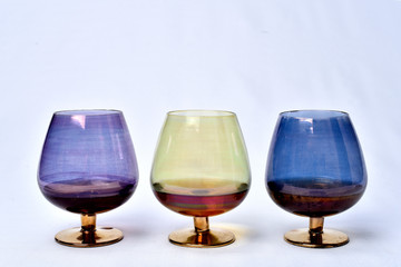 Colorful drinks glass cup on table on white background