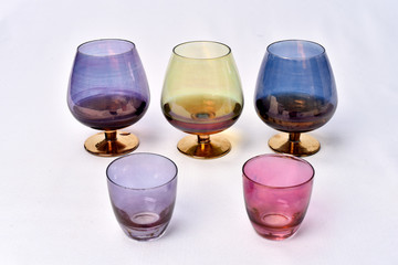 Colorful drinks glass cup on table on white background
