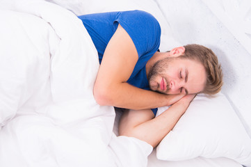 Get enough amount of sleep every night. Bearded man sleeping face relaxing. Maintaining consistent circadian rhythm is essential for general health. Man handsome guy sleeping. Tips sleeping better