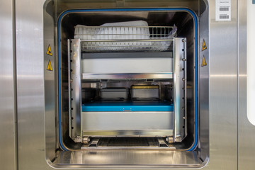 different instrument containers are pushed into a sterilization unit