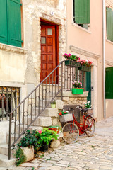 Fototapeta na wymiar One of the narrow back streets in the historic old town of Rovinj in Croatia