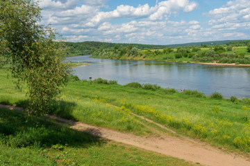 Obraz premium Beautiful view from the hill to the Oka and bewitching clouds in the blue sky