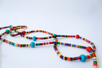 dna shape of bright colorful beauty beads necklace isolated on white background