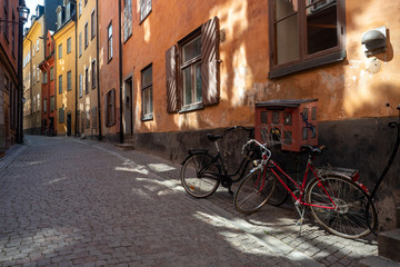 Fototapeta na wymiar Bicycles are in a narrow street
