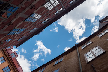 narrow alley with blue sky