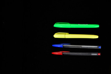 Fototapeta premium colorful ballpoint pens on black background