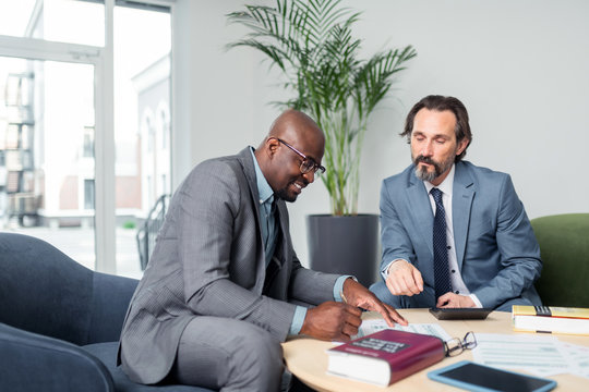 Dark-skinned Businessman Having Consultation Of Tax Specialist