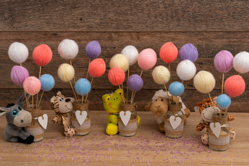 Yellow plush frog with flaxen thread balls