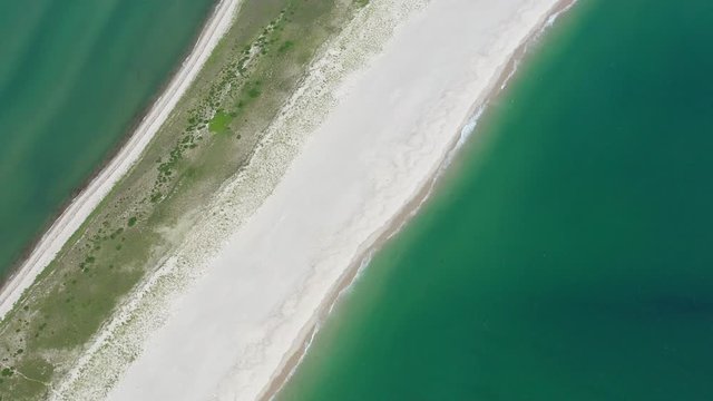 The nutrient-rich waters of the Atlantic Ocean bathe a scenic beach on Cape Cod, Massachusetts. This beautiful area of New England, not too far from Boston, is a popular summer vacation destination.