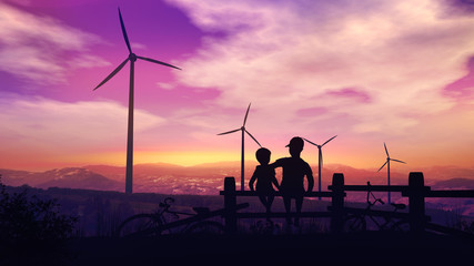 Fototapeta na wymiar Two boys at sunset look at wind turbines
