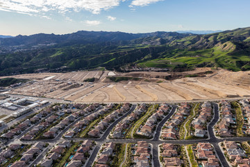 Fototapeta na wymiar Aerial view of expanding suburban housing developments in Los Angeles, California.
