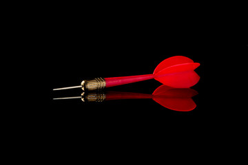 Red dart on a black background. Hit the target