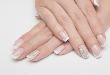 Fototapeta premium Manicure and white abstract pattern on women's nails