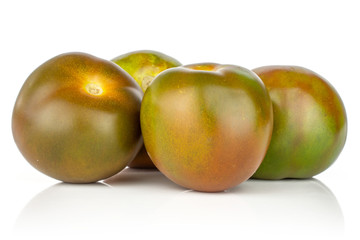 Group of four whole fresh greenish red tomato isolated on white background