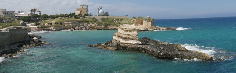 Lighthouse owned by the Navy and touistic village of Torre Sant'Andrea in Salento.