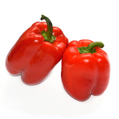 Bell pepper on white background. Two red peppers. Isolated backdrop. Macro. Closeup. Fresh vegetables. Organic food.