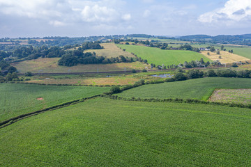 Fototapeta na wymiar Aerial View over British Countryside Fields at Summer