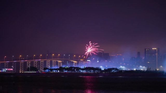 night illuminated macau city traffic bridge fireworks panorama timelapse 4k china 