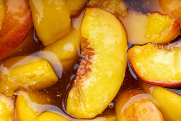peach jam. peaches with sugar syrup. above. looking above. fruit background backdrop. studio shot.