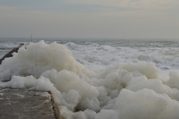 Waves and foam on the beach