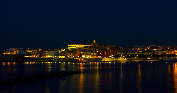 Day to night time lapse of seafront of Otranto Roman castle, Salento, Puglia, Italy, eye level shot