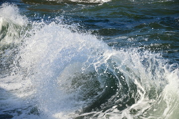 Waves with splashes on the beach