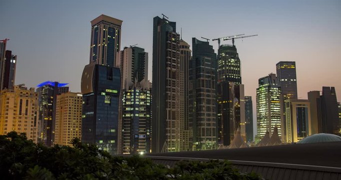 Night to day time lapse of sunrise over financial district in Doha, Qatar, middle east, eye level shot, Football World Cup 2022