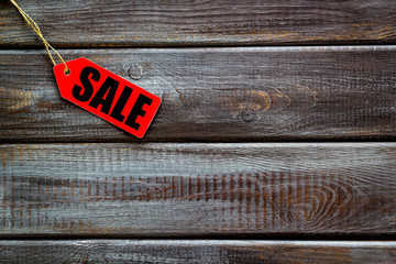 Sale in shop with lable on wooden background top view mockup