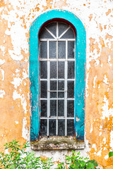 Fototapeta na wymiar Tall, arch shaped ancient window