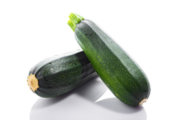 Zucchini or green marrow squash  isolated on white background