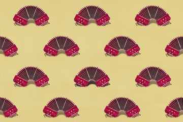 Seamless geometric tango background with bandoneons on yellow color paper