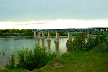 Fototapeta na wymiar train bridge over South Saskatchewan River