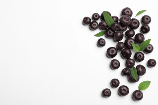 Fresh acai berries on white background, top view