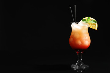 Just made appetizing cocktail Sex on the Beach, black background. Space for text