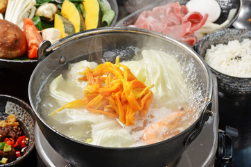 Lily flowers and shrimp in a hot pot    