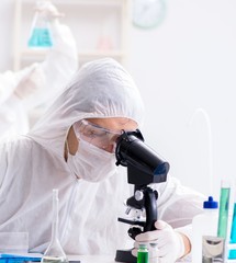 Two chemists working in the lab