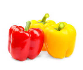 Fresh ripe bell peppers on white background