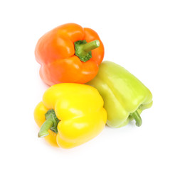 Fresh ripe bell peppers on white background