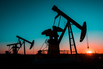 In the evening oil field, the pump is running.