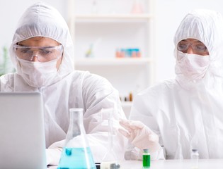 Two chemists working in the lab