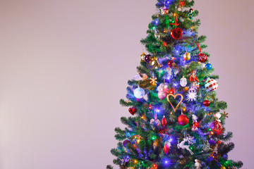 Christmas tree with multicolor led lights and copy-space background