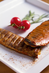 Grilled mackerel fish fillet in mustard sauce.  View from above, top studio shot