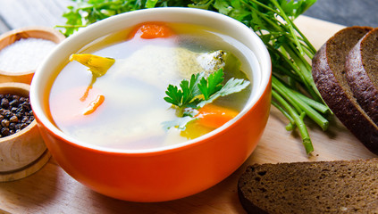 Fish soup served on the table in plate