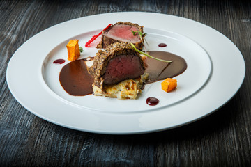 exquisite decorated medium raw grilled meat pieces with sauce