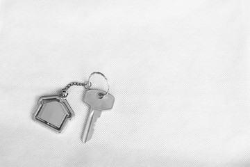 House key with home keyring in on white background