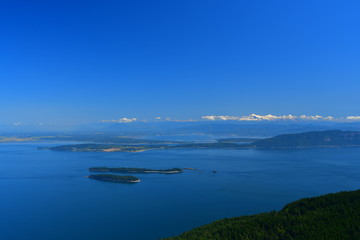 Fototapeta na wymiar Panoramic view of the San Juan Islands with Mount Baker in the background as seen from Mount Constitution on Orcas Island, Washington