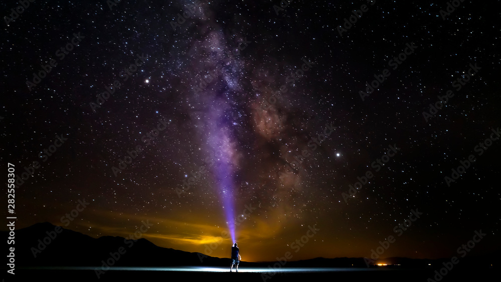 Wall mural black rock desert milky way self portrait with flashlight.