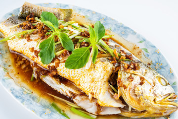 Chinese national dish steamed flower yellow croaker on white background